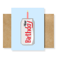 A square birthday greeting card with a light blue background featuring an illustration of a silver soda can with a pink striped candle and the words 'Happy Birthday' in red and black. The card is displayed upright with brown kraft paper envelopes on both sides against a white background.