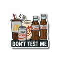 A die-cut sticker featuring cartoon illustrations of McDonald's and Diet Coke beverages with the text 'DON'T TEST ME' on a white background.