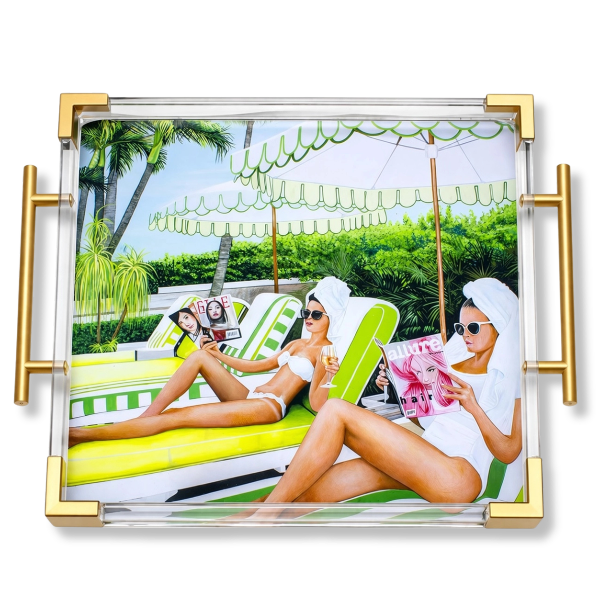 A square acrylic serving tray with gold metal corner frames and side handles, featuring a colorful printed photo of three women lounging by a pool on green and white chaise lounge chairs.
