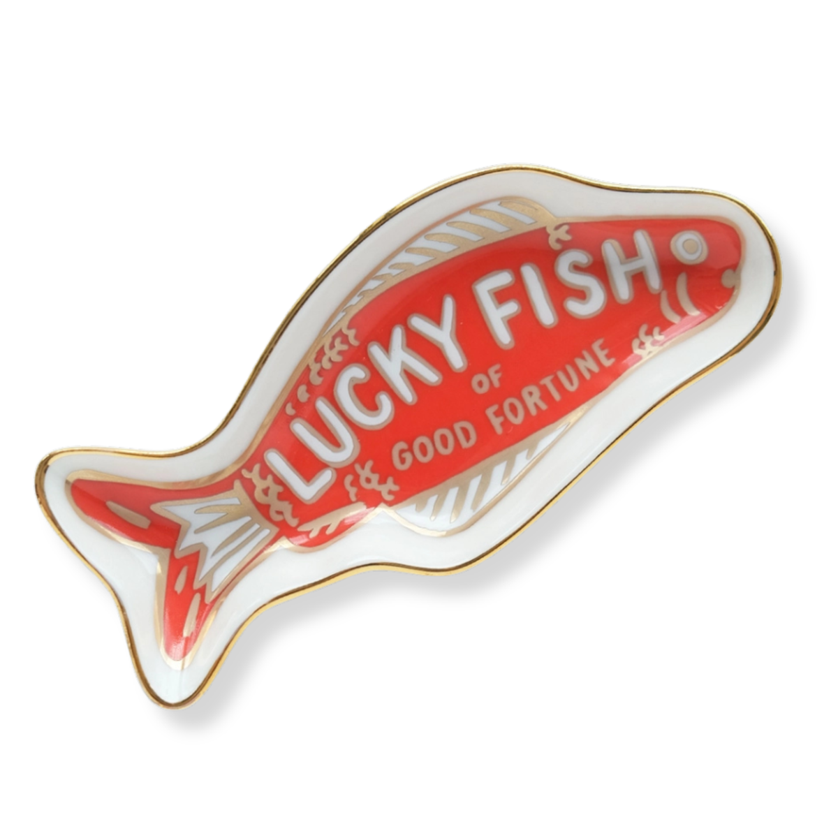 A fish-shaped ceramic dish with a red center, white lettering that reads 'LUCKY FISH OF GOOD FORTUNE,' and a gold outline on a white background.