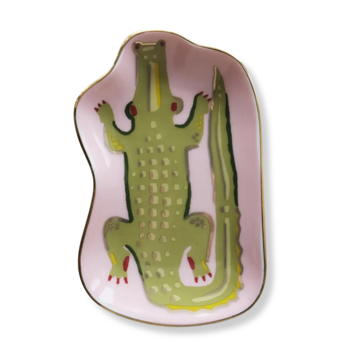 A pink ceramic serving platter shaped like a crocodile, featuring a green crocodile illustration with red eyes and claws, and a gold rim, shown on a white background.